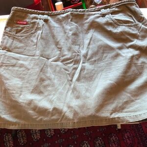 Size 14 Nevada army green skirt, zipper in back, pockets, slits, belt buckles